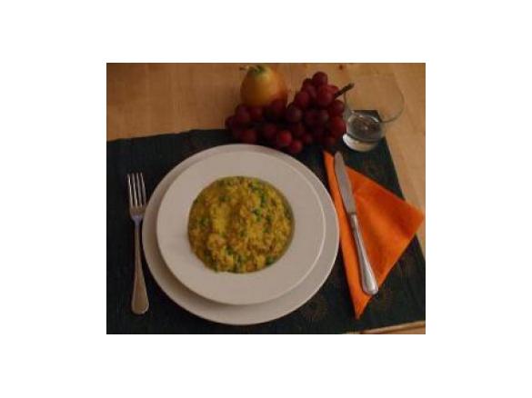 Risotto con salsiccia, piselli e zafferano