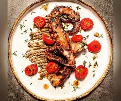 Polpo glassato al miele (cottura lenta sottovuoto), con crema di ceci neri, pomodorini confit e crumble di olive taggiasche