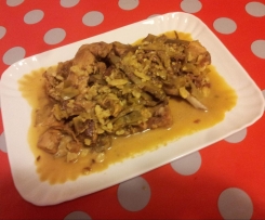 Coniglio allo zafferano con mandorle e carciofi