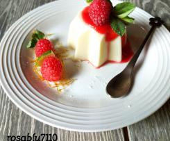 Panna cotta al lime con salsa di  vino bianco e lamponi (contes ristorante)